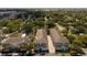 Aerial view of townhomes situated amongst trees and green landscaping at 528 Lanark Ct, Orlando, FL 32806