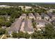 Aerial shot of a community of townhomes and lush surrounding greenery at 528 Lanark Ct, Orlando, FL 32806