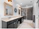Bathroom boasting double vanities with a shower, modern lighting, and neutral wall paint at 528 Lanark Ct, Orlando, FL 32806