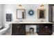 Bathroom with double sinks, modern lighting, neutral paint, and lots of storage at 528 Lanark Ct, Orlando, FL 32806