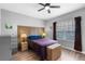 Stylish bedroom with wood-look floors, neutral walls, and a unique headboard design for a modern and comfortable space at 528 Lanark Ct, Orlando, FL 32806