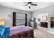 Bedroom showcases en-suite bathroom, ceiling fan, wood laminate flooring, and neutral paint at 528 Lanark Ct, Orlando, FL 32806