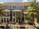 Exterior elevation showing townhome with landscaped yard and front porch steps at 528 Lanark Ct, Orlando, FL 32806