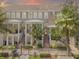 Charming townhouse featuring a private entrance, covered porch and neatly landscaped yard at 528 Lanark Ct, Orlando, FL 32806