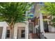 Charming front entrance with brick steps, mature tree, and a welcoming wreath at 528 Lanark Ct, Orlando, FL 32806