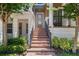 Inviting front entrance with brick steps and black railing, adding curb appeal to the property at 528 Lanark Ct, Orlando, FL 32806