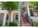 Charming front entrance with brick steps, mature tree, and inviting front door at 528 Lanark Ct, Orlando, FL 32806