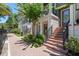 Charming townhome exterior with brick walkway, front door, and lush landscaping at 528 Lanark Ct, Orlando, FL 32806
