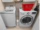 Well-equipped laundry room with white washer and dryer units, offering a functional and convenient space at 528 Lanark Ct, Orlando, FL 32806