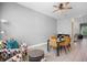 Cozy living area with comfortable seating, ceiling fan, and dining area, with tile floors at 528 Lanark Ct, Orlando, FL 32806