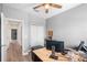 Bright office space with neutral walls, wood-look floors, and a modern desk setup for optimal productivity at 528 Lanark Ct, Orlando, FL 32806