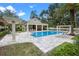 Community pool with lounge seating, clubhouse, landscaping, and lots of space to sit and enjoy the view at 528 Lanark Ct, Orlando, FL 32806