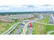 Expansive aerial view of a residential community featuring numerous single-Gathering homes and well-manicured green spaces at 5345 Tuscany Ln, Davenport, FL 33897