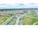 Aerial view of a large neighborhood with meticulously planned streets and lush greenery at 5345 Tuscany Ln, Davenport, FL 33897