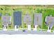 Aerial view of rooftops with well-manicured lawns; showcasing the neighborhood's landscaping at 5345 Tuscany Ln, Davenport, FL 33897