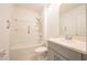 Bathroom with a shower and tub, vanity, tile flooring, and neutral color scheme at 5345 Tuscany Ln, Davenport, FL 33897