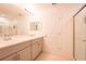 Spacious bathroom featuring a double vanity with modern fixtures, a shower, and tile flooring at 5345 Tuscany Ln, Davenport, FL 33897