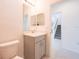 Cozy bathroom featuring a vanity with neutral cabinets and a framed mirror at 5345 Tuscany Ln, Davenport, FL 33897