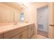 Bright bathroom featuring a double vanity with modern fixtures and plenty of counter space at 5345 Tuscany Ln, Davenport, FL 33897
