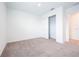 Clean and airy bedroom with carpet and a sliding door closet for ample storage at 5345 Tuscany Ln, Davenport, FL 33897