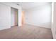 Bright bedroom with carpet, closet with sliding doors, and a view into the hallway at 5345 Tuscany Ln, Davenport, FL 33897