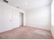 Bright carpeted bedroom with closet, neutral walls, and natural light from a window at 5345 Tuscany Ln, Davenport, FL 33897