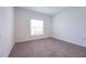 Bedroom featuring light brown carpet, neutral colored walls, and one window at 5345 Tuscany Ln, Davenport, FL 33897