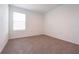 Neutral bedroom with cozy carpet, a bright window, and ample natural light at 5345 Tuscany Ln, Davenport, FL 33897