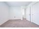 Neutral bedroom with carpet flooring, white walls, and closet; ample natural light at 5345 Tuscany Ln, Davenport, FL 33897