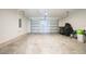 Spacious two-car garage with automatic door, offering ample space for vehicles and storage at 5345 Tuscany Ln, Davenport, FL 33897