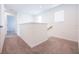 Bright hallway with carpet flooring and white walls, connecting different areas of the home at 5345 Tuscany Ln, Davenport, FL 33897