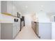 Stylish kitchen featuring gray cabinets, stainless steel appliances, and modern countertops at 5345 Tuscany Ln, Davenport, FL 33897