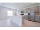 Modern kitchen featuring gray cabinets, white countertops, and stainless steel appliances at 5345 Tuscany Ln, Davenport, FL 33897