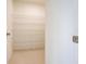 Walk-in pantry featuring wire shelving, providing ample storage space at 5345 Tuscany Ln, Davenport, FL 33897