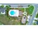 Aerial view of a community pool with ample seating and green landscaping at 5345 Tuscany Ln, Davenport, FL 33897