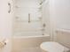 Bathroom featuring a walk-in shower with grab bar, ensuring safety and convenience at 5345 Tuscany Ln, Davenport, FL 33897