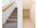Carpeted staircase featuring a wooden handrail and adjacent storage space at 5345 Tuscany Ln, Davenport, FL 33897