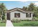 Charming single-story home featuring a well-manicured lawn, and beautiful landscaping at 5662 Paddock Fence Ln, Apopka, FL 32712