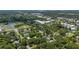 Expansive aerial view showcasing the neighborhood with lush greenery, buildings and commercial district at 608 Cedar Ave, Holly Hill, FL 32117