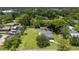 Aerial view of the property with expansive lawn and mature trees creates a private oasis at 608 Cedar Ave, Holly Hill, FL 32117