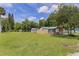 Expansive backyard featuring a lush green lawn, perfect for outdoor activities and enjoyment at 608 Cedar Ave, Holly Hill, FL 32117
