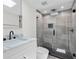 Bathroom with glass enclosed shower, marble countertop, and modern fixtures at 608 Cedar Ave, Holly Hill, FL 32117