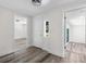 Bright entryway featuring wood-look flooring, fresh paint, and views into other rooms of the home at 608 Cedar Ave, Holly Hill, FL 32117