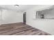 Open-concept living area with new floors and pass-through kitchen view at 608 Cedar Ave, Holly Hill, FL 32117