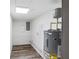 Bright utility room with a modern water heater and updated electrical panel at 608 Cedar Ave, Holly Hill, FL 32117