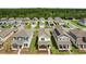 Aerial view of a residential neighborhood featuring well-maintained homes and landscaped yards at 6449 Sprucepine Ln, St Cloud, FL 34771
