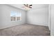 Bedroom with carpet, ceiling fan, and window with blinds at 6449 Sprucepine Ln, St Cloud, FL 34771