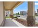 Inviting front porch with stone accents, offering a charming view of the neighborhood street at 6449 Sprucepine Ln, St Cloud, FL 34771