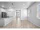 Open concept living area with tile floors, kitchen island, and lots of light at 6449 Sprucepine Ln, St Cloud, FL 34771
