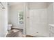 Bathroom featuring a walk-in shower, and window at 702 Pasteur Ln, Kissimmee, FL 34759